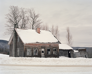 snow covered farm house