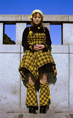 example of asian street fashion featuring black and yellow billowy pantsuit