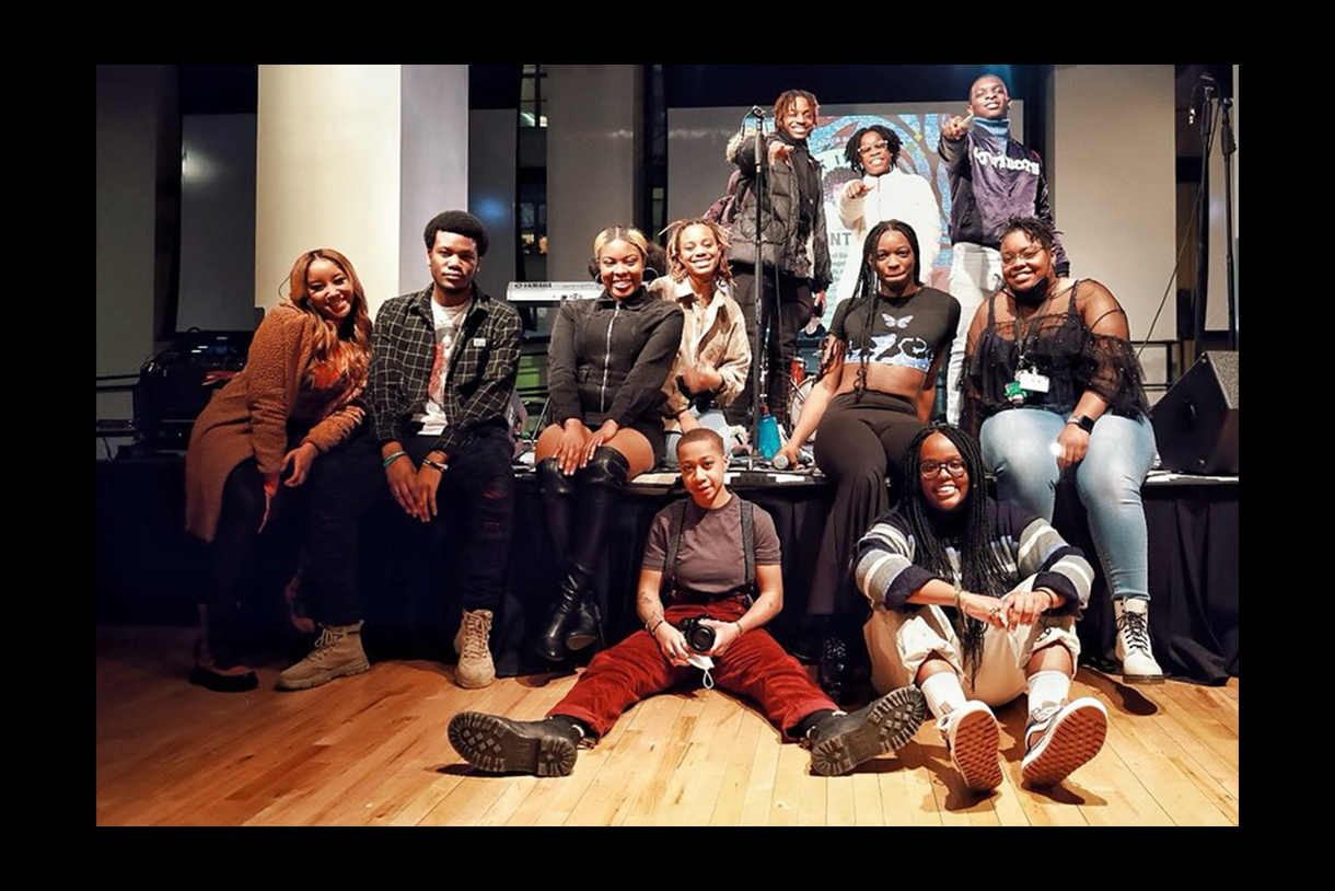 students from the black student union pose on stage