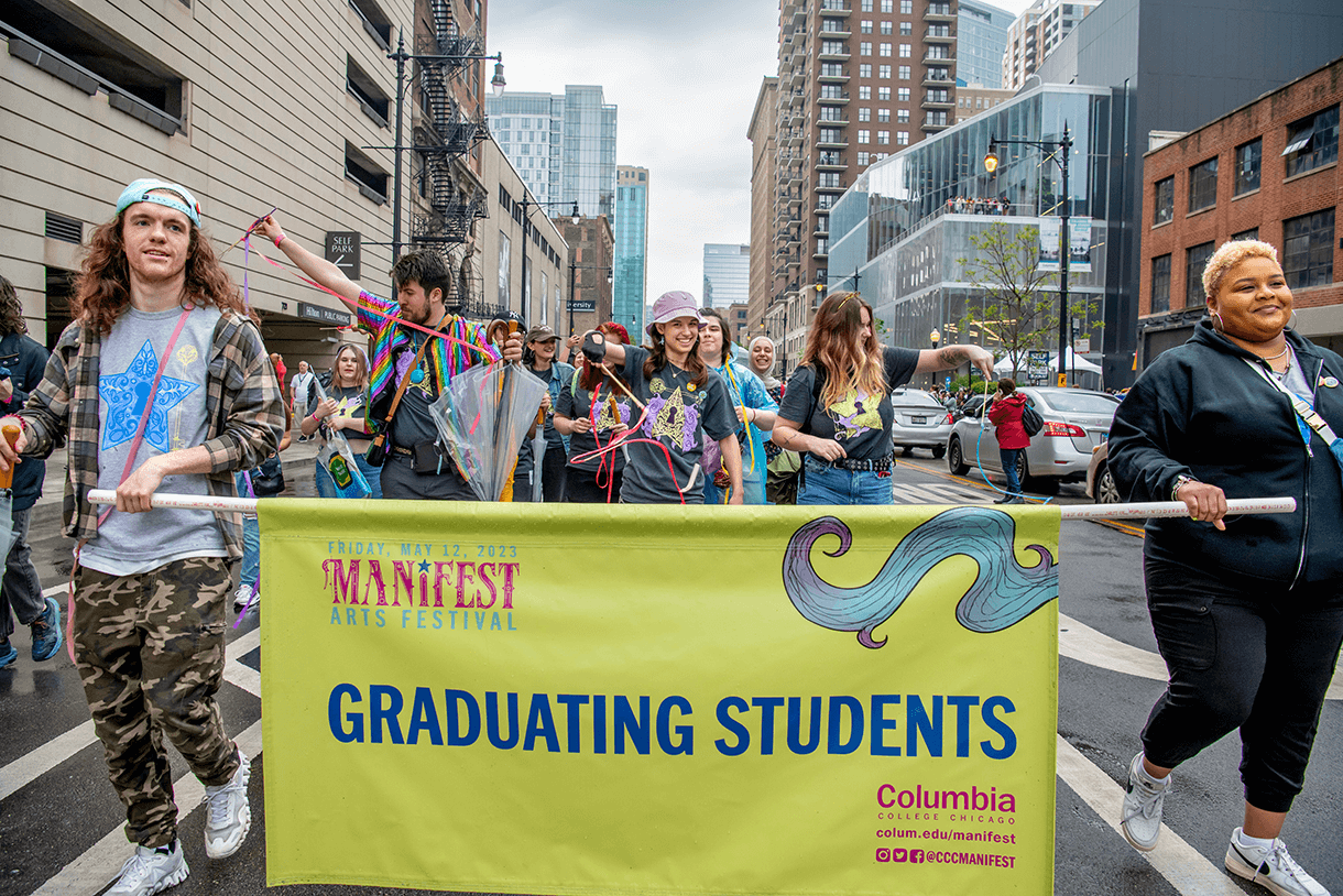 students walk down the street during manifest 2023