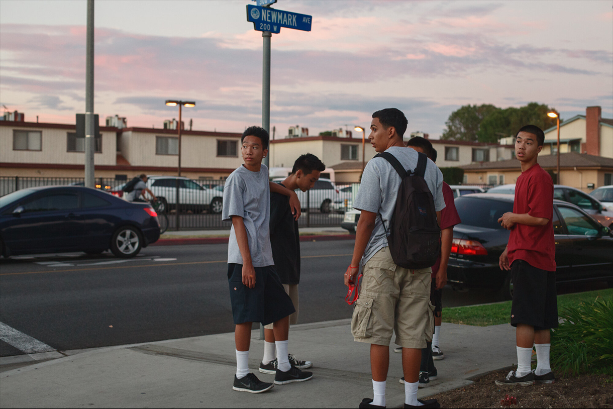 Jessica Chou Teens in Chicano-influenced streetwear at the corner of Ramona Ave and Newmark Ave, Monterey Park from the Suburban Chinatown series, 2013. 